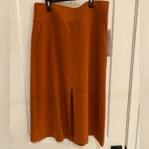 New with tags, rust color, front slit skirt